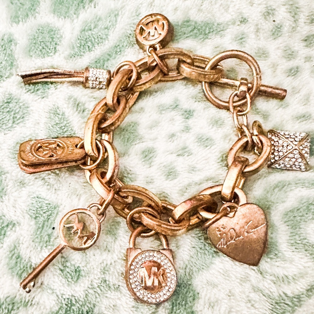 Micheal Kors charm bracelet. Beautiful rose gold MK charm bracelet